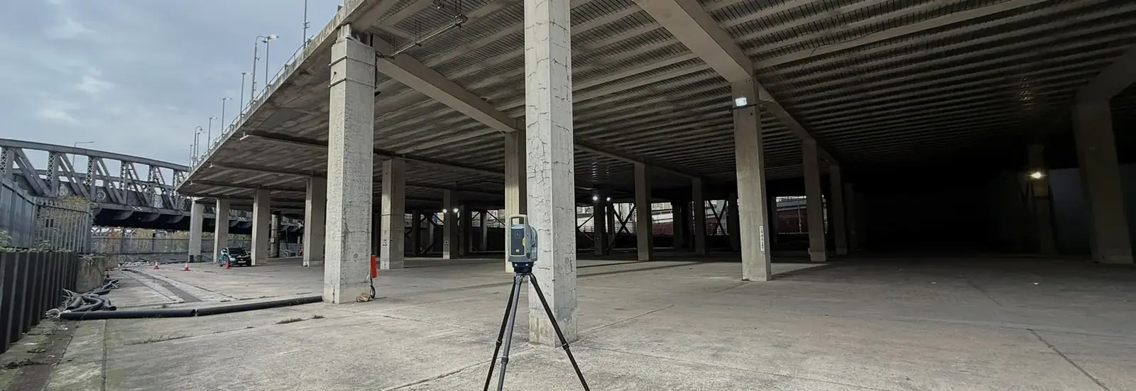 Houseborn engineer surveying on a live site